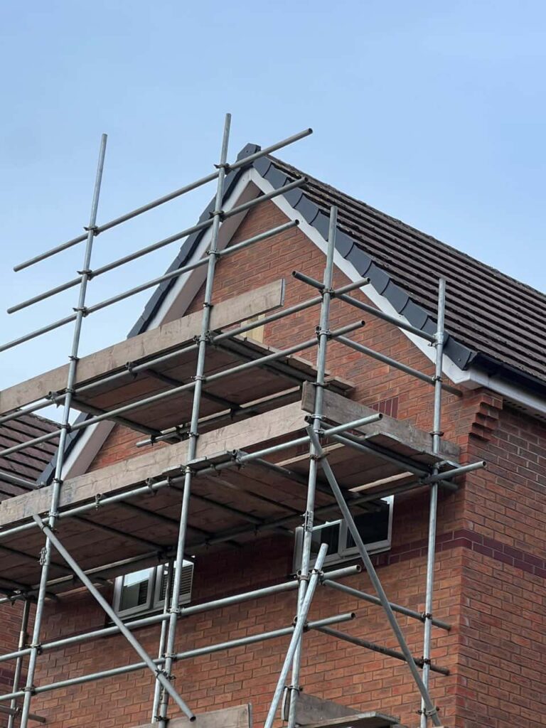 This is a photo of a roof which has just been repaired. There is a scaffold located at the gable end for access onto the roof. Works carried out by LJ Roofing Witney