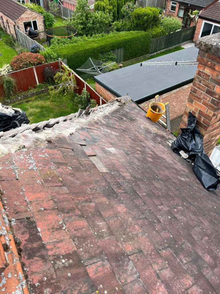 This is a photo of a roof where the hip tiles have been removed, and are just about to be replaced. Works carried out by LJ Roofing Witney