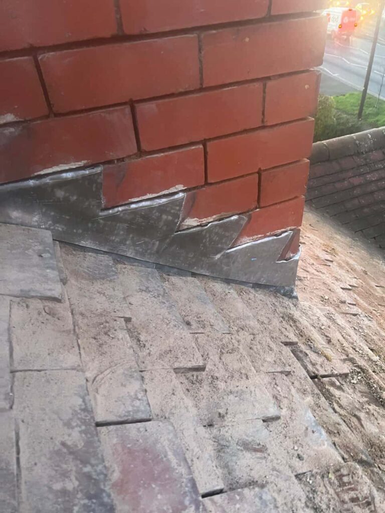 This is a photo of new leadwork being installed around an old chimney. Works carried out by LJ Roofing Witney